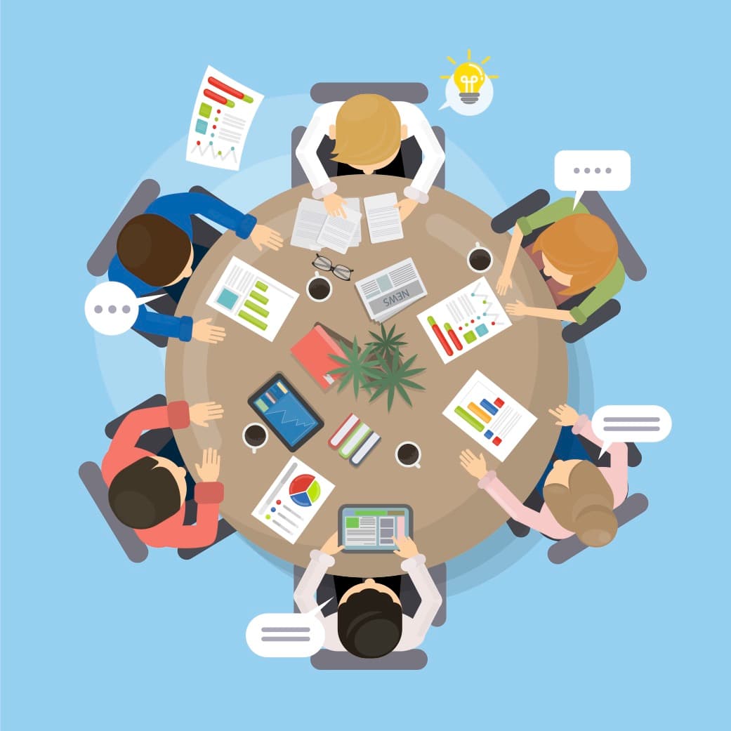 丸いテーブルでミーティングを行う